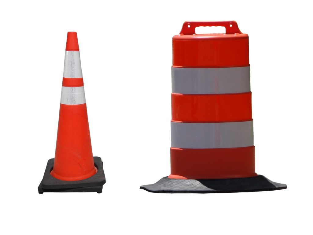 Two orange traffic cones beside each other