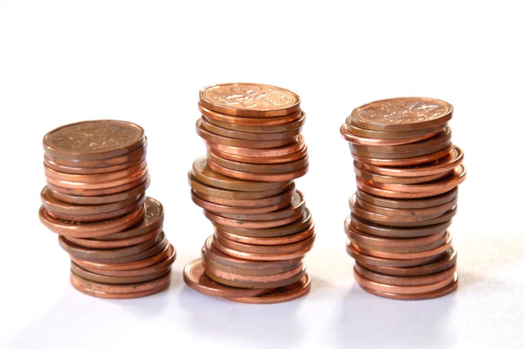 Coins stacked in three piles.