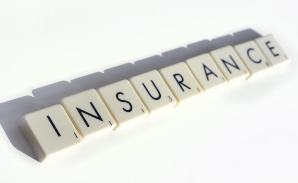 Scrabble tiles spelling out the word insurance.