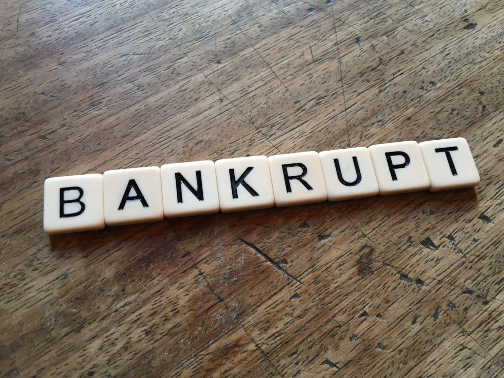 Scrabble tiles spelling out the word "bankrupt".